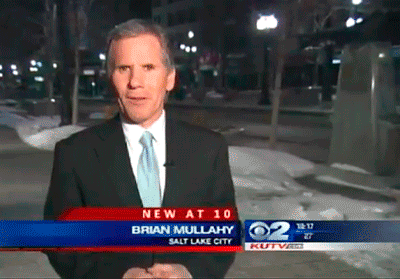 gif of a local news reporter getting kissed on air 